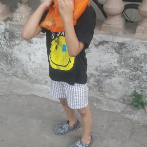 excited little fellow filled an orange pouch with all the coins